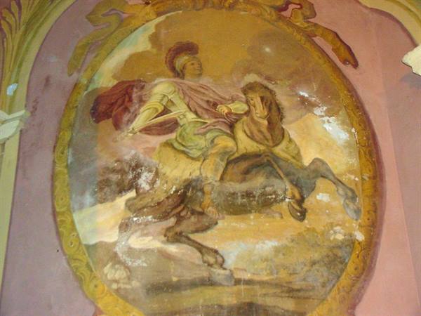 Oval fresco of helmeted warrior with horse on faded pink wall
