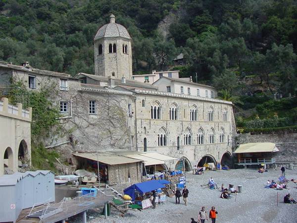 San Fruttuoso abbey overlooking the crowded pebble beach