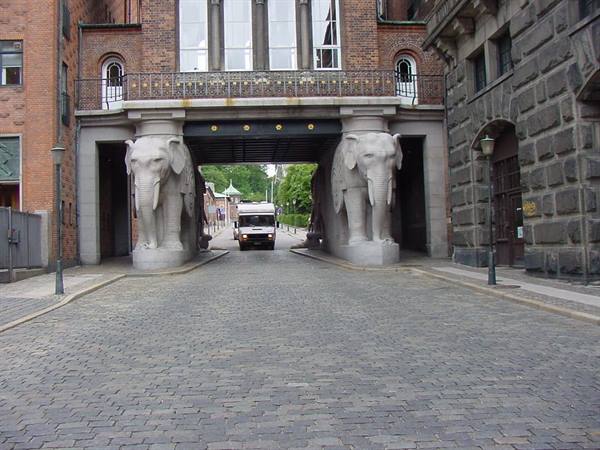 The Elephant Gate at Carlsberg Brewery in Copenhagen, with a truck passing through