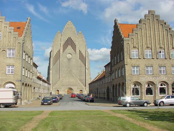 Grundtvig's Church in Copenhagen, yellow brick facade among matching buildings