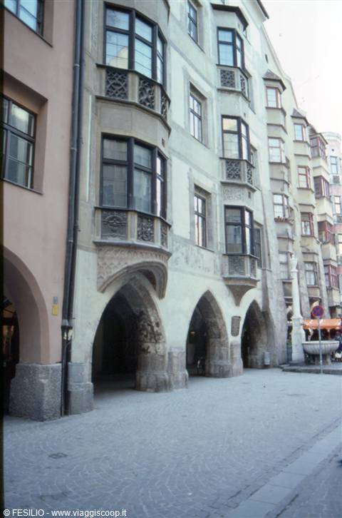 Building with Gothic arcades and oriels on Innsbruck's cobblestone street