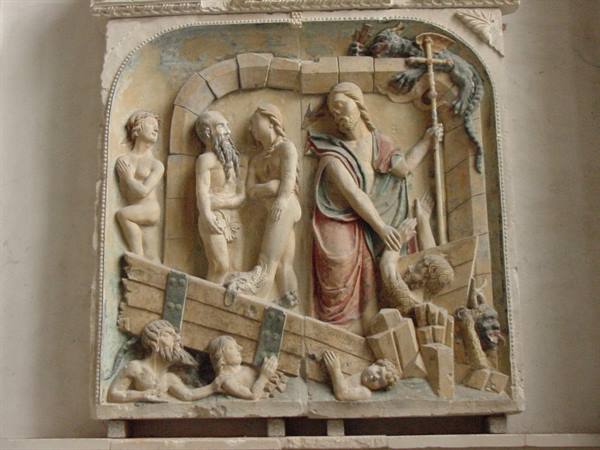 Painted stone relief of Christ with cross and staff among souls in limbo