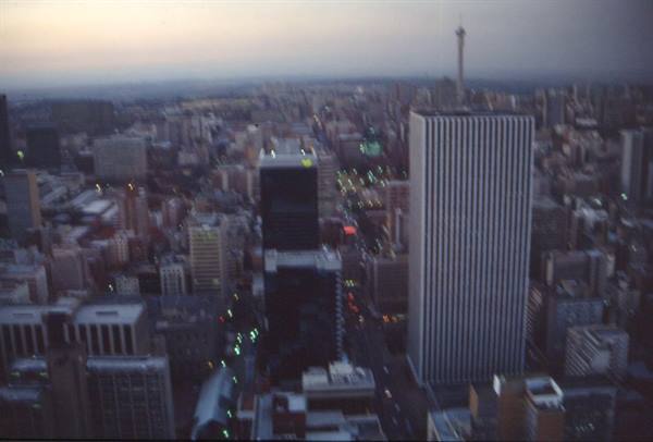Johannesburg skyscrapers at dusk, with the Hillbrow Tower in the background