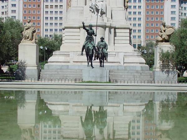 Cervantes monument with Don Quixote and Sancho reflected in the pond, Plaza de España