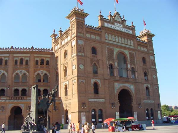 Las Ventas bullring in Madrid, brick facade with statues and visitors