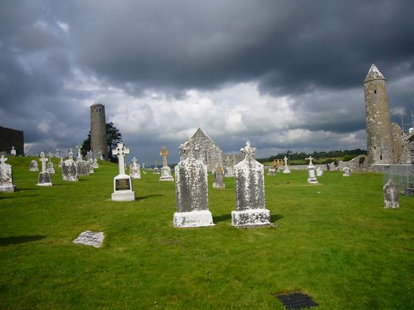 Graveyard with Celtic crosses and round stone towers at Clonmacnoise