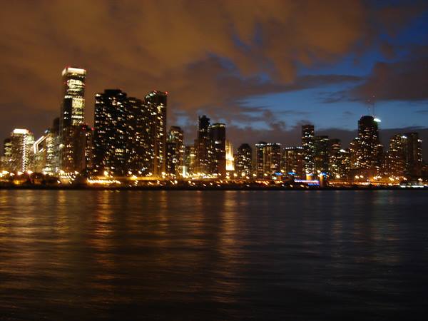 Chicago illuminated skyscrapers reflected in Lake Michigan at night