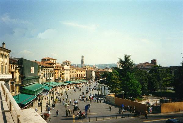 Piazza Bra in Verona with green awnings and the Arena on the right