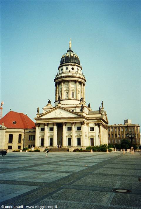The Deutscher Dom at Gendarmenmarkt in Berlin, neoclassical facade under blue sky