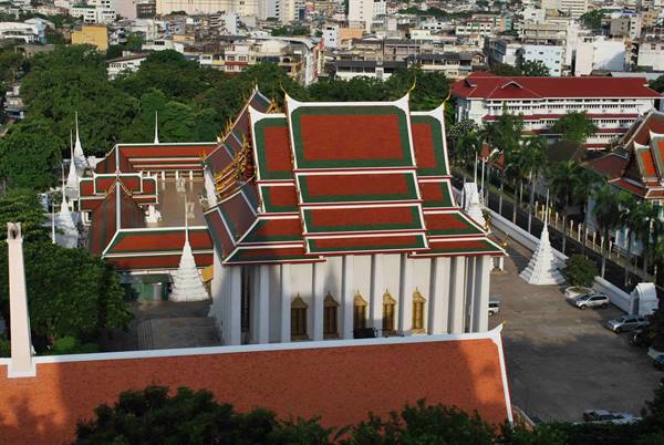 Buddhist temple with red and green tiered roofs, Bangkok