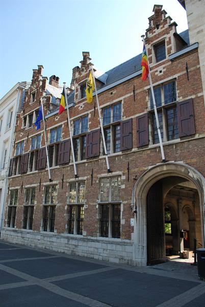 Brick and stone facade with gothic gables and flags, Rubens House in Antwerp