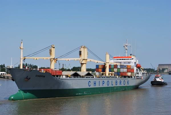 Chipolbrok Chopin container ship sailing with a tugboat alongside
