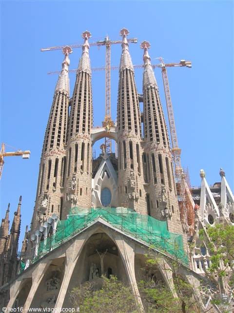 Sagrada Familia in Barcelona, stone spires with cranes still working