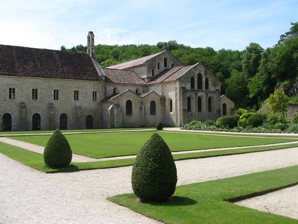 Fontenay Abbey in light stone amid geometric gardens and green woods