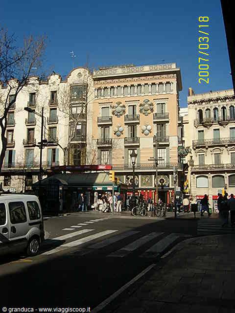 Modernist buildings with balconies over a busy Barcelona intersection