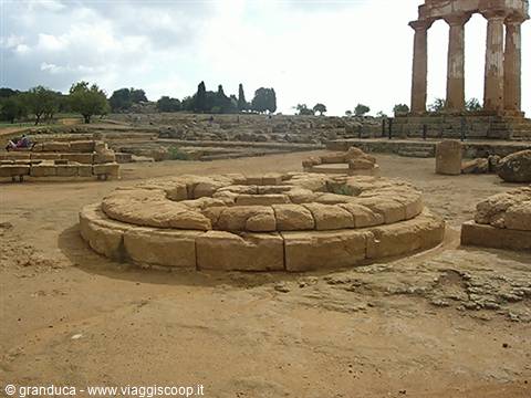 Circular stone altar base among Greek ruins, Valley of the Temples, Agrigento