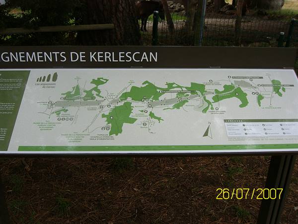 Information board with map of the Kerlescan alignments, stones visible behind