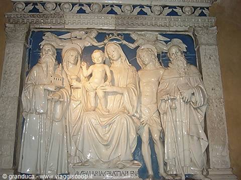 White and blue glazed terracotta altarpiece: Madonna with Child and saints, chapel