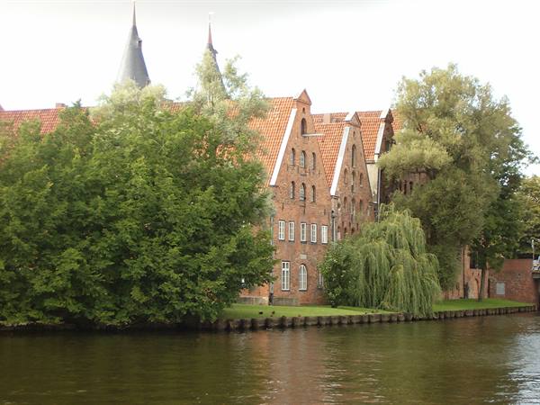 Red brick salt warehouses along the Trave river in Lübeck
