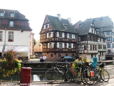 Timbered houses along the canal, parked bicycles, La Petite France district, Strasbourg