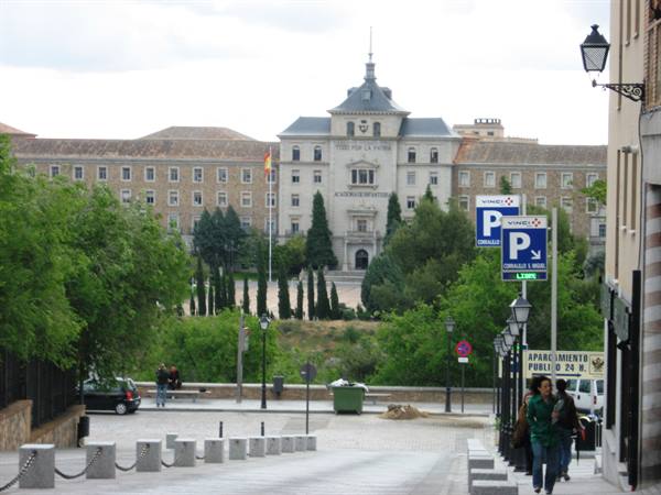 Hospital de la Caridad in Toledo seen from the street with pedestrians