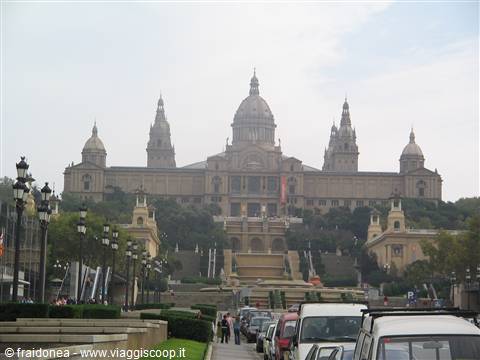 MNAC museum in Barcelona, dome and cascading staircase, traffic and lampposts in foreground