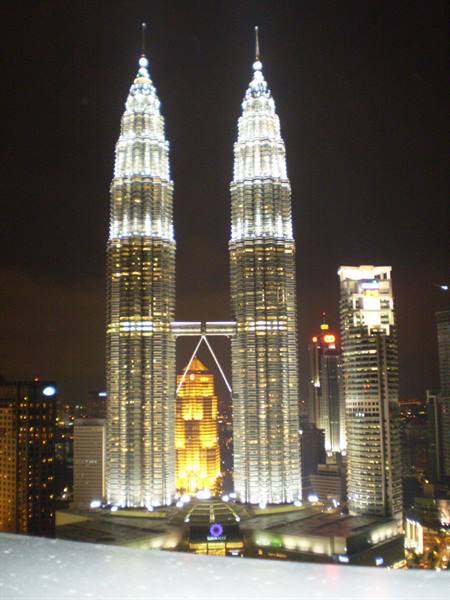 The Petronas Towers illuminated at night in Kuala Lumpur