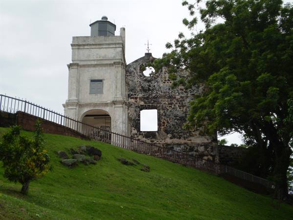 Ruins of St. Paul's Church in Malacca, weathered stone walls under gray sky