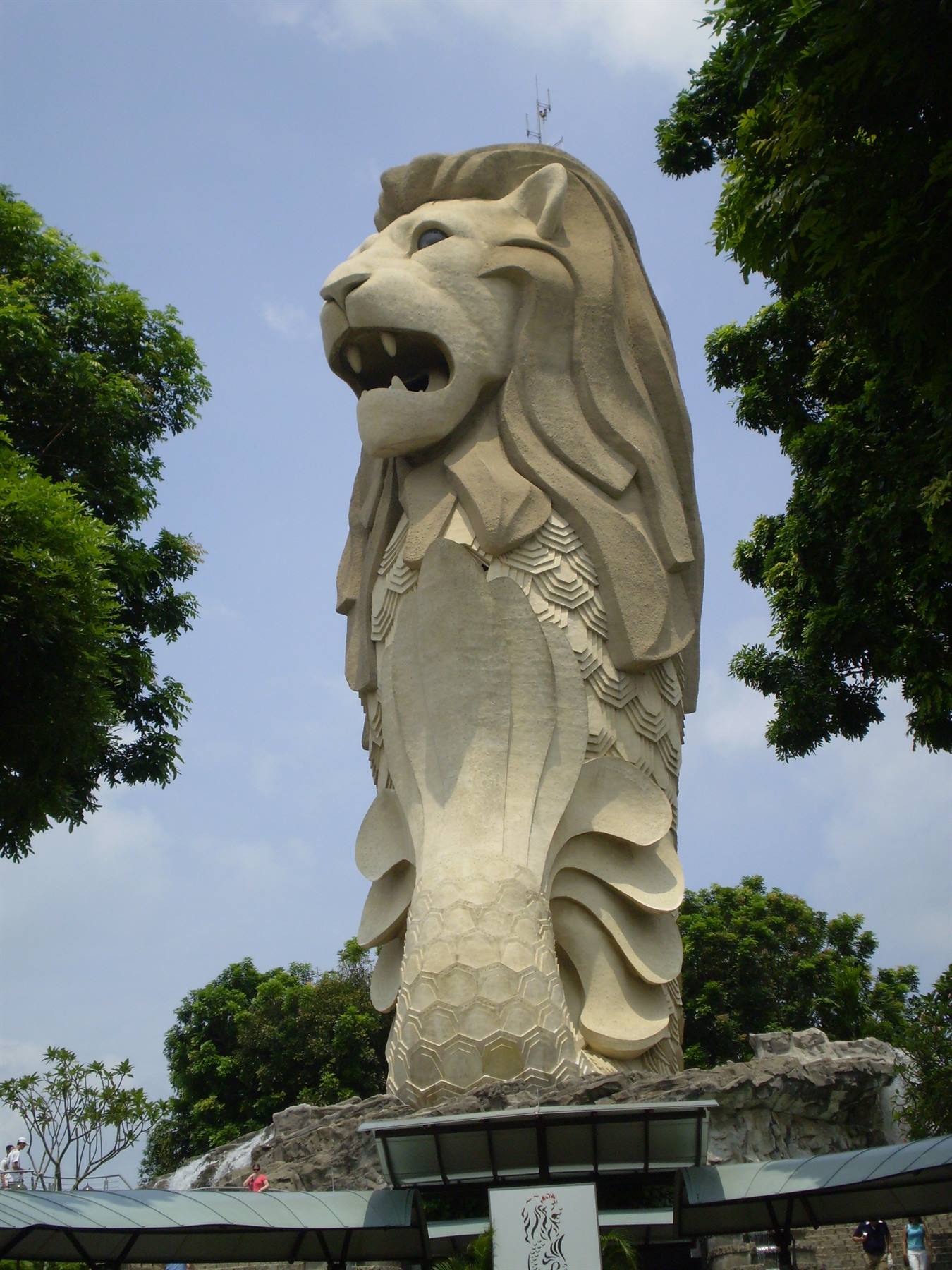 The Merlion statue in Singapore among trees, daylight