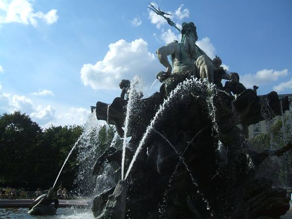 Neptune Fountain bronze statue with water jets, Alexanderplatz, Berlin