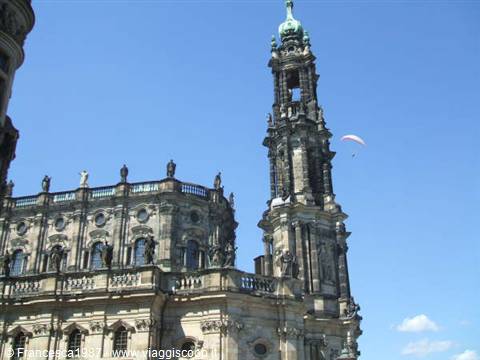 The stone tower of Dresden's Hofkirche against a blue sky