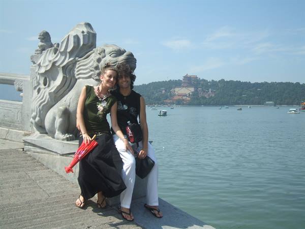 Couple beside marble lion at Kunming Lake, Summer Palace, Beijing
