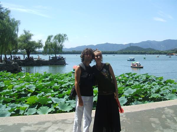 Couple beside lotus leaves at Kunming Lake, Summer Palace, Beijing