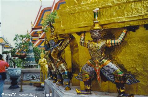 Yaksha demon statues supporting the golden base of Wat Phra Kaeo, Bangkok
