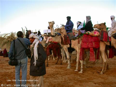 Tuareg riders on adorned camels at the Ghat folklore festival
