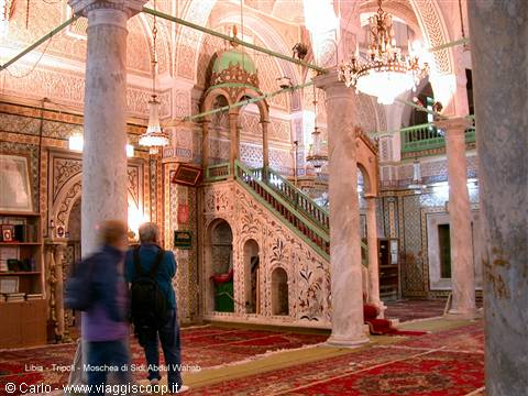 Visitors beside the carved marble minbar of the Karamanli Mosque, Tripoli