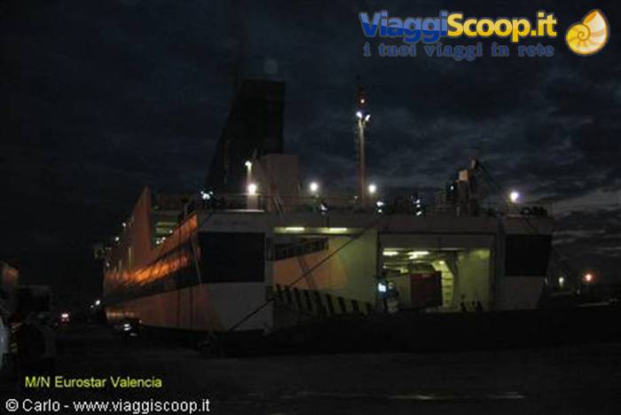 Eurostar Valencia ferry in port at night, lights glowing on deck