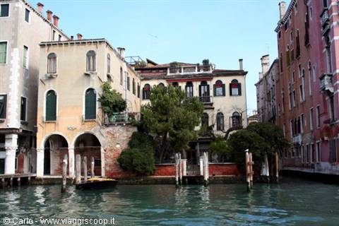 Historic palaces facing the Grand Canal in Venice, daylight on the facades