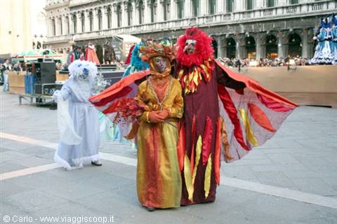Carnival costumes in St Mark's Square, red and gold satin masks