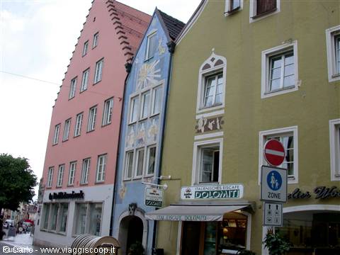 Colorful Gothic-style facades above a Dolomiti shop in the old town