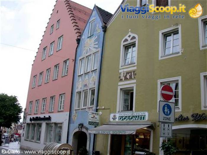 Colorful Gothic-style facades above a Dolomiti shop in the old town