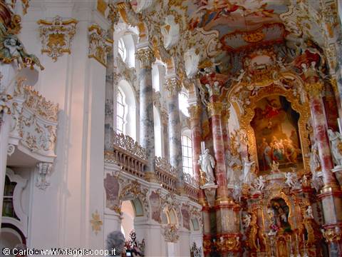 Rococo interior of the Wieskirche: gilded stucco, frescoes and side altar