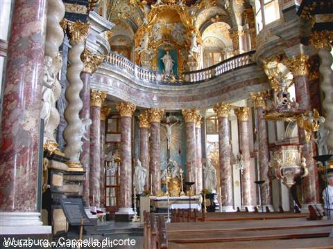 Baroque interior of Dresden Hofkirche: marble columns, golden altar, statues