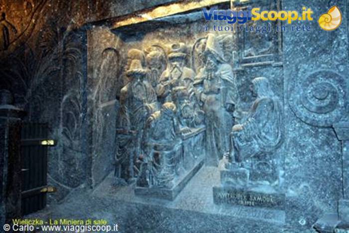 Salt-carved sculptures in Wieliczka Mine, warm light on historic figures