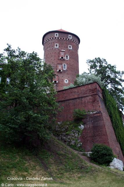 The round red-brick tower of Wawel Castle rising above the walls, Kraków