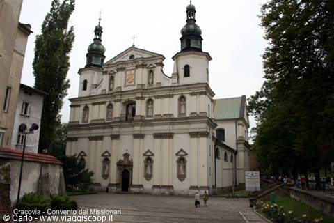 White baroque church with two green towers, in Kraków