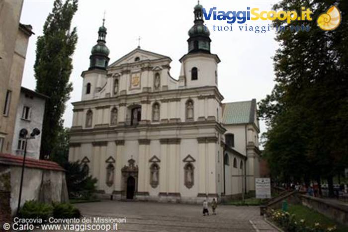 White baroque church with two green towers, in Kraków