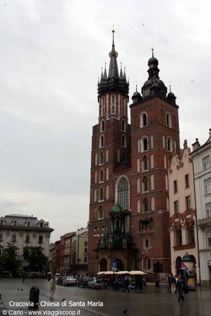 St. Mary's Basilica in Kraków, red-brick twin towers under grey sky