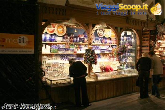 Ceramic and glass stalls lit up in Kraków's Cloth Hall market