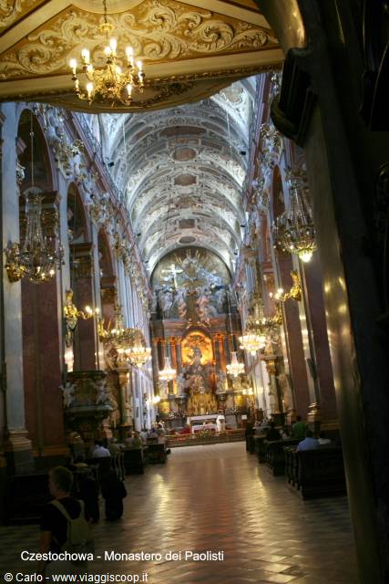 Baroque interior of Jasna Góra basilica in Częstochowa, gilded altar glowing